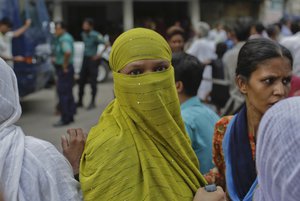 Relatives wait to meet prisoners outside the Dhaka Central Jail in Dhaka, Bangladesh, Sunday, June 12, 2016.