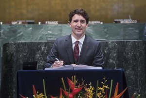 Justin Trudeau, Prime Minister of Canada, signs the Paris Agreement.