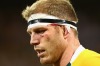 David Pocock leaves the field with a cut under his eye in the first Test.