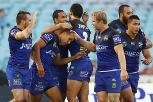 Reward: Bulldogs halfback Moses Mbye celebrates after scoring against the Dragons at ANZ Stadium.