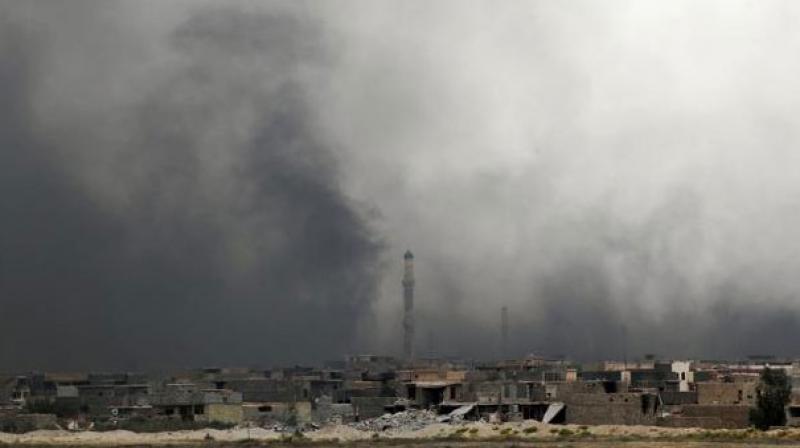 Smoke billows from Fallujah's southern Shuhada neighbourhood following shelling during an operation by Iraqi government forces. (Photo: AFP)