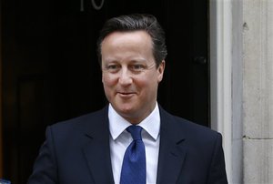 Britain's Prime Minister David Cameron leaves Downing Street to attend the weekly session of Prime Ministers Questions in parliament in London, Wednesday, Jan. 21, 2015.