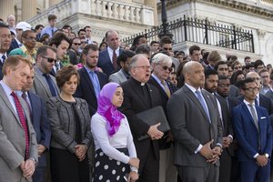 Members of Congress join the LGBT Congressional Staff Association and the Congressional Muslim Staff Association for a prayer and moment of silence on the steps of the Capitol to stand in solidarity with the Orlando community and to remember the victims of Sunday's shooting at an LGBT night club, in Washington, Monday, June 13, 2016.