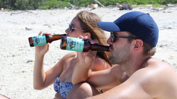 Tourists enjoying Queensland's beaches.