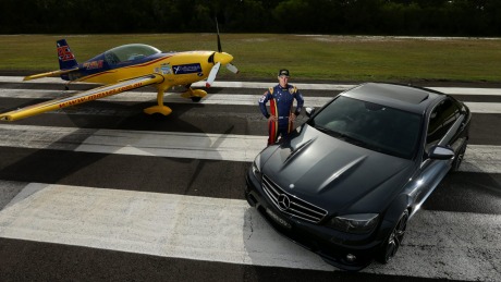 Aerial wizard Matt Hall with his stunt plane and his Mercedes-AMG C63.