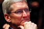 Apple CEO Tim Cook listens to U.S. President Barack Obama speak at the Summit on Cybersecurity and Consumer Protection ...