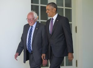 President Barack Obama walks with Democratic presidential candidate Sen. Bernie Sanders, I-Vt., down the Colonnade of the White House in Washington, Thursday, June 9, 2016.