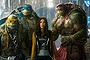 Megan Fox as April O'Neil with her sidekicks  in Teenage Mutant Ninja Turtles: Out of the Shadows.