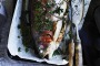 Whole roasted ocean trout with lemon and thyme.