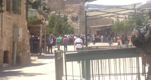 Palestinians praying outside Ibrahimi mosque