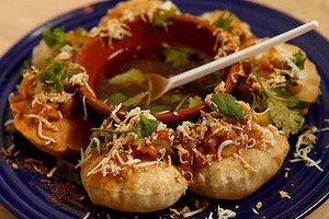 Street snacks: Fuchka - chickpea flour pastries filled with yellow lentil dhal, egg, cucumber and tamarind sauce at Rizq Bangladeshi restaurant in Footscray.