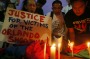 Filipinos light candles during a vigil to pay tribute to the victims of the Orlando, Fla. mass shooting.