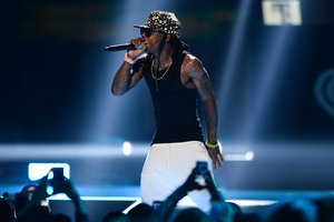 Lil Wayne performs at Day 1 of the 2015 iHeartRadio Music Festival at the MGM Grand Garden Arena on Friday, Sept. 18, 2015, in Las Vegas.