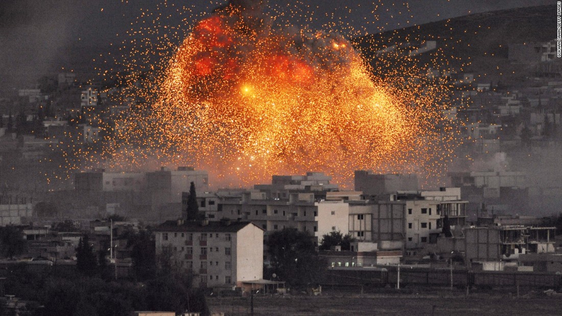 An explosion rocks Kobani, Syria, during a reported car bomb attack by ISIS militants on Tuesday, October 20.