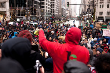 Laquan McDonald Black Friday Mag Mile Protest March. Following the November 27th protest march down Michigan Ave (Magnificent Mile) for Laquan McDonald who was shot 16 times & killed by a Chicago Police Officer who has since been charged. Protests erupted after video of the incident was released to the public. Photo by kgnixer on Flickr.