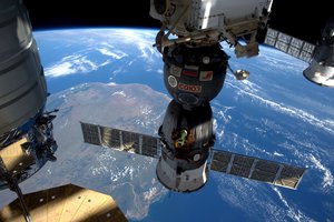 File - Expedition 47 Flight Engineer Tim Peake of the European Space Agency took this photograph on April 6, 2016, as the International Space Station flew over Madagascar, showing three of the five spacecraft currently docked to the station.