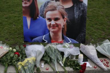 Tributes for Labour Party MP Jo Cox, who was shot dead in the street in northern England, are displayed on Parliament Square in London, Britain, June 16, 2016. | Photo: Reuters