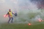 Flares are thrown onto the pitch during the Euro 2016 Group D match between the Czech Republic and Croatia in ...