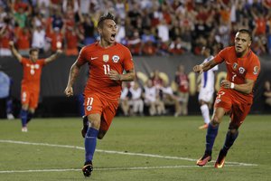 Chile's Eduardo Vargas (11) and Alexis Sanchez (7) celebrate after Vargas' goal during the first half of a Copa America Group D soccer match against Panama, Tuesday, June 14, 2016, in Philadelphia.