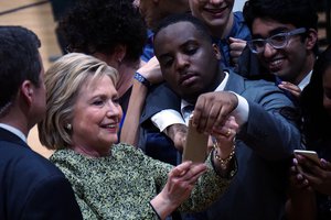 Hillary Clinton takes a selfie with a supporter at a campaign rally at Hillside High School in Durham, North Carolina,10 March 2016