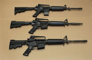 n this photo taken Wednesday, Aug. 15, 2012, three variations of the AR-15 assault rifle are displayed at the California Department of Justice in Sacramento, Calif. While the guns look similar, the bottom version is illegal in California because of it's quick reload capabilities. State Sen. Leland Yee, D-San Francisco, is proposing to change California law to make it more difficult and time-consuming to reload. The proposed measure is one of a number of gun control laws being introduced in some the nations most populous states after the recent shootings in Colorado.