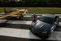 Aerial wizard Matt Hall with his stunt plane and his Mercedes-AMG C63.