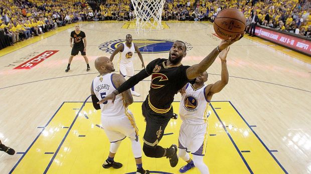 Champion: LeBron James drives for a layup.