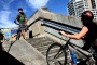 Cyclists on the steps leading up to the Harbour Bridge. 