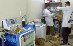  Doctors sort through medicine and equipment they&acute;ve just received on the opening day of the new Sheik Zayed hospital in Baghdad, Tuesday, May 6, 2003. The hospital was financed by the United Arab Emirates, and named after its leader, Sheik Zayed bi