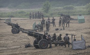 South Korean army soldiers prepare to fire 105 mm howitzers during an exercise in Paju, South Korea, near the border with North Korea, South Korea, Wednesday, June 22, 2016.