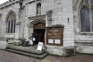 People leave a polling station in St-Giles-without-Cripplegate church in the City of London on the day of the EU referendum, London, Thursday, June 23, 2016. Britain votes whether to stay in the European Union in a referendum today.