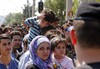 Syrian Refugees and migrant at the Greece-Macedonia border barrier, 24 August 2015