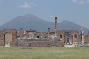 Pompeii, with Vesuvius towering above. The ruins of Pompeii are situated at coordinates 40°45′00″N 14°29′10″E﻿ / ﻿40.75°N 14.48611°E﻿ / 40.75; 14.48611, near the modern suburban town of Pompei.