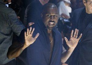 Kanye West arrives at the presentation of Lanvin's Spring/Summer 2015 ready-to-wear fashion collection, presented in Paris, France, Thursday, Sept. 25, 2014.