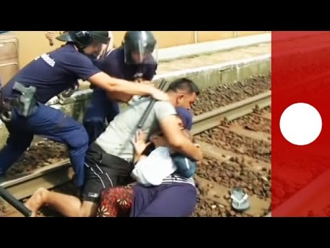 Distraught Syria refugee pulls wife and baby onto train tracks, Hungary