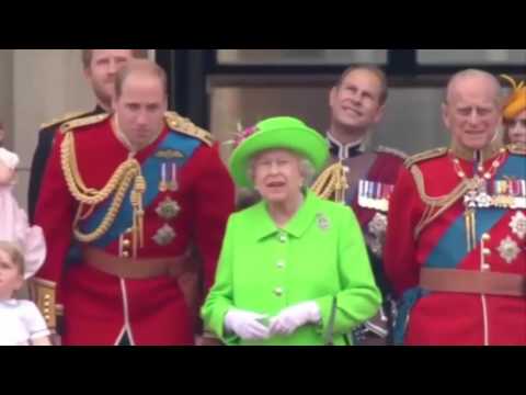 The Queen tapped William's arm with a gloved hand and apparently told him to stand up