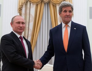 Secretary of State John Kerry shakes hands with Russian President Vladimir Putin as they meet at the Kremlin in Moscow, Russia, Thursday, March 24, 2016.