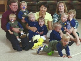 Bobbi and Kenny with the septuplets and their oldest daughter, Mikayla, as the toddlers turned 2.