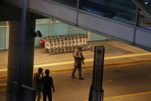 Turkish security officers gather outside Istanbul's Ataturk airport, Tuesday, June 28, 2016.