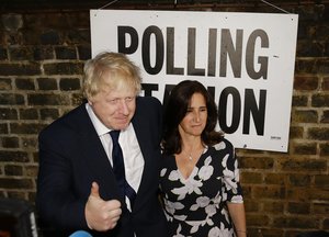 British MP Boris Johnson and his wife Marina are photographed as they leave after voting in the EU referendum in London, Thursday June 23, 2016.