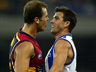 MAY 2, 2003: Wayne Carey (L) and Anthony Stevens clash during North Melbourne Kangaroos v Adelaide Crows at the Telstra Dome in Melbourne, 02/05/03. Pic George Sal.Australian Rules