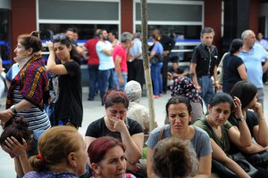 Family members of victims cry outside Bakirkoy State Hospital in Istanbul, Wednesday, June 29, 2016.