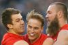 Demons Jack Trengove, Bernie Vince and Max Gawn celebrate the win against Collingwood in round 12. 