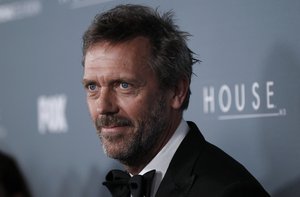 File - Cast member Hugh Laurie arrives at the "House" series finale wrap party Los Angeles, Friday, April 20, 2012.