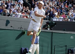 Sam Querrey of the U.S celebrates after beating Novak Djokovic of Serbia in their men's singles match on day six of the Wimbledon Tennis Championships in London