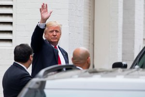 Donald Trump, the GOP’s presumptive presidential nominee, waves as he arrives to meet with Speaker of the House Paul Ryan, R-Wis., for their first face-to-face meeting at Republican National Committee Headquarters on Capitol Hill in Washington, Thursday, May 12, 2016, just a week after Ryan stunned Republicans by refusing to back the billionaire for president.