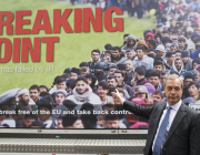 Nigel Farage in front of a Leave campaign poster