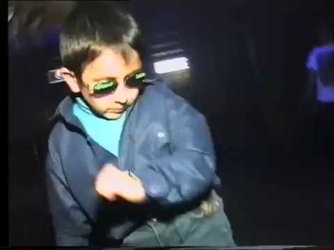 Russian kid dancing  at club can't be bothered. 1997.