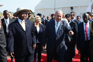 Israeli Prime minister Benjamin Netanyahu, right, with Uganda president Yoweri Museveni on this arrival in at  Entebbe airport Uganda