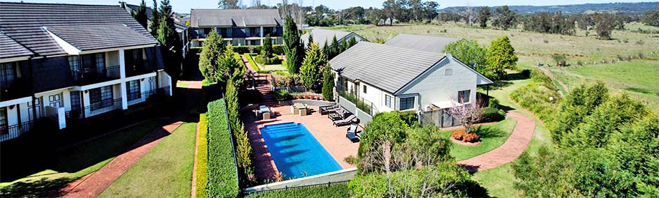 Relax by the pool surrounded by beautiful gardens.